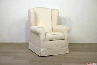 poltrona imbottita con schienale alto