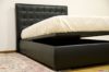 letto con testata trapuntata
