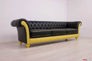 Vista laterale del divano Chesterfield su misura con rivestimento in pelle nera e gialla